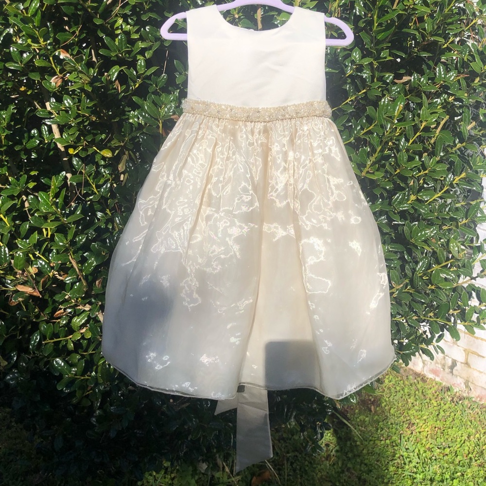 Ivory satin dress with a pearl and sequin waistband.